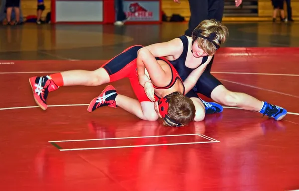 Young wrestlers in tournament.